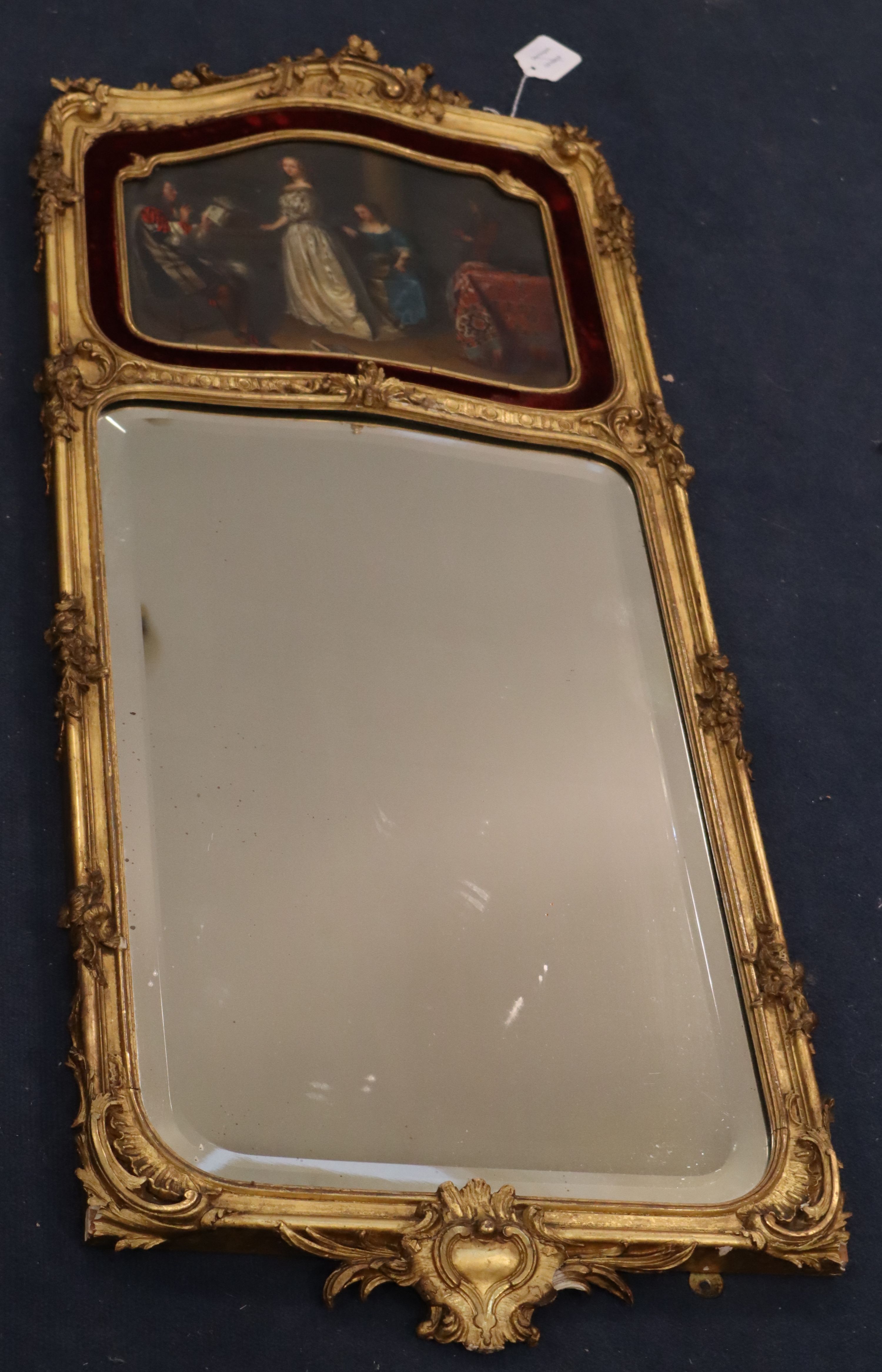 A late 19th century carved giltwood wall mirror, W.43cm overall H.104cm